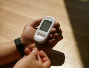a person holding a thermometer in their hand
